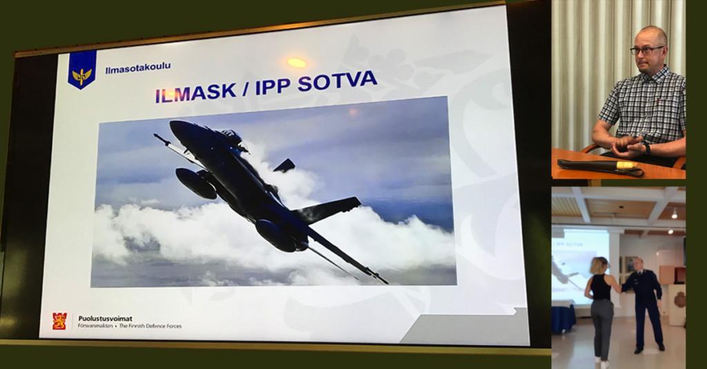 Kuva Ilmasotakoulun näytöstä ja palkitut mies ja nainen